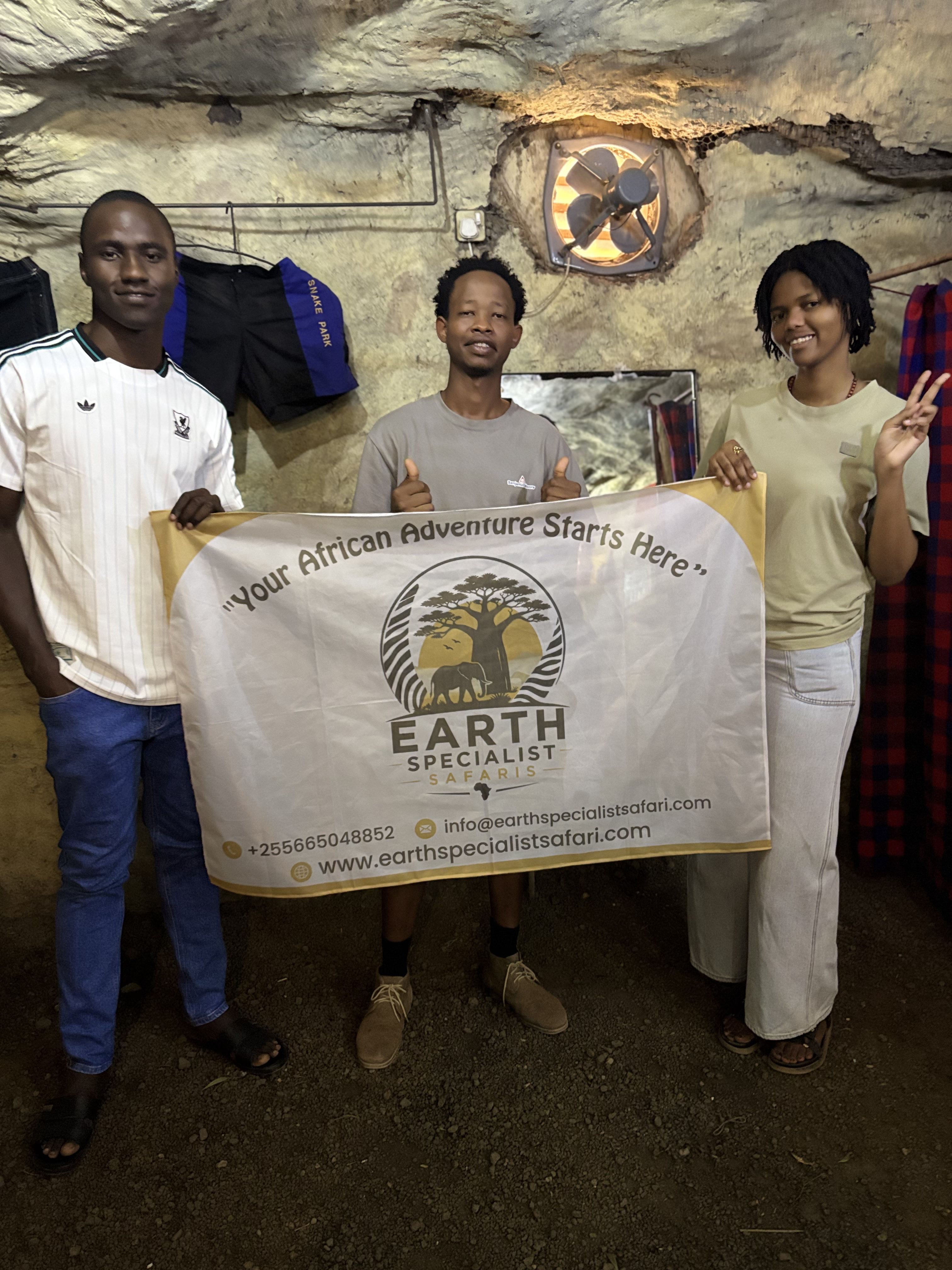 Earth Specialist Safaris Guides Holding Official Banner